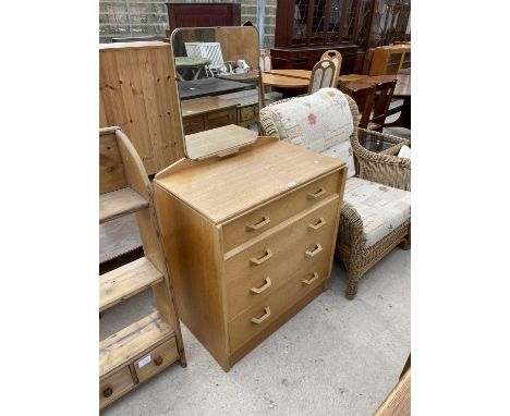 A LIGHT OAK FOUR DRAWER DRESSING CHEST 