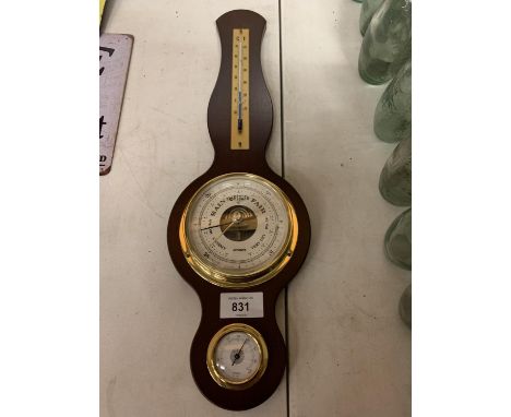 A SMALL WOODEN WALL BAROMETER 