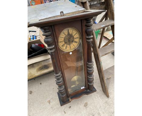 A VINTAGE DECORATIVE VIENNA WALL CLOCK WITH KEY 