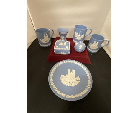 SEVEN ITEMS OF WEDGWOOD BLUE JASPERWARE TO INCLUDE COMMEMORATIVE TANKARDS, A LIDDED TRINKET BOX, POMANDER BALL, VASE AND PLAT