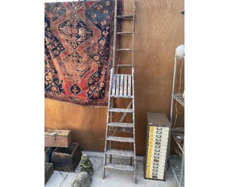 A 5 RUNG WOODEN STEP LADDER AND A FURTHER 10 RUNG WOODEN LADDER 