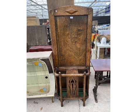 AN EARLY 20TH CENTURY OAK HALL COAT/STICK STAND WITH ART NOUVEAU STYLE PIERCED FRONT PANEL, 25" WIDE 