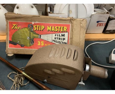 A VINTAGE 'THE STIP MASTER' 35MM FILM STRIP PROJECTOR 