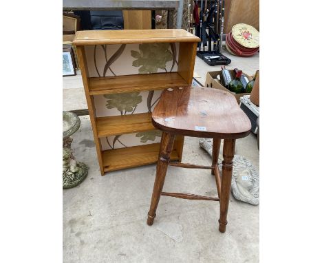 A WOODEN STOOL AND A THREE SHELF WOODEN BOOKCASE 