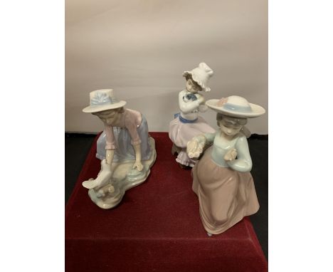 THREE NAO FIGURINES TO INCLUDE A GIRL WITH A DOVE, A GIRL WITH A PUPPY AND ONE WITH A BASKET OF FLOWERS 