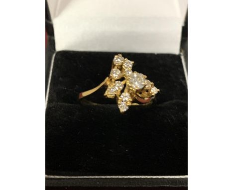 A DECORATIVE ABSTRACT DESIGN 18 CARAT GOLD DIAMOND CLUSTER RING 3.47G APPROXIMATELY 60 PTS SIZE: O 