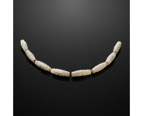 EIGHT BI-CONICAL WHITE JADE BEADS, EASTERN ZHOUPlease note this Lot is to be sold at No Reserve. 本拍品不設底價Jade. China, Eastern 