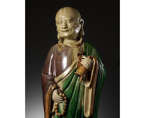 A MASSIVE SANCAI-GLAZED FIGURE OF A MONK, LATE MING DYNASTY TO KANGXI PERIOD 明末至康熙朝三彩僧人像Please note this Lot is to be sold at