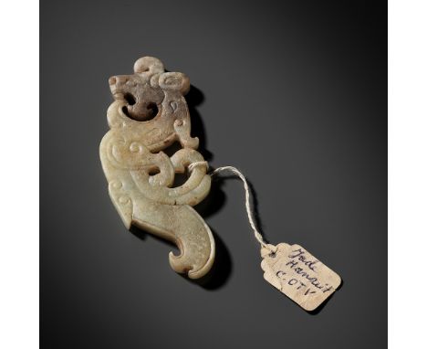 A SUPERB CELADON AND BROWN JADE ‘DRAGON’ PENDANT, WESTERN HAN DYNASTY 西漢青玉龍紋佩Please note this Lot is to be sold at No Reserve