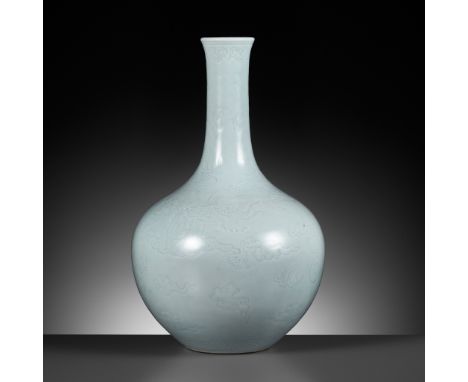 AN ANHUA DECORATED CLAIR-DE-LUNE ‘DRAGON’ BOTTLE VASE, TIANQIUPING, QIANLONG MARK AND POSSIBLY OF THE PERIOD 乾隆款天藍釉暗花龍紋天球瓶，或爲