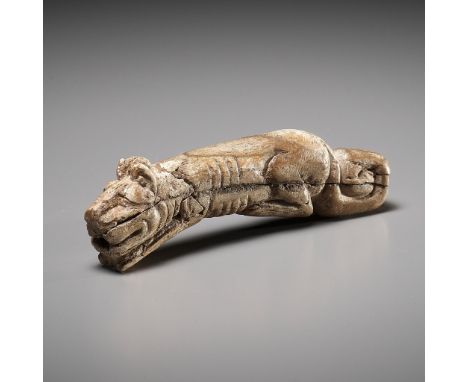 A RARE CARVED BONE FIGURE OF A TIGER, SHANG DYNASTY 商代罕見臥虎形骨觿Please note this Lot is to be sold at No Reserve. 本拍品不設底價China, 