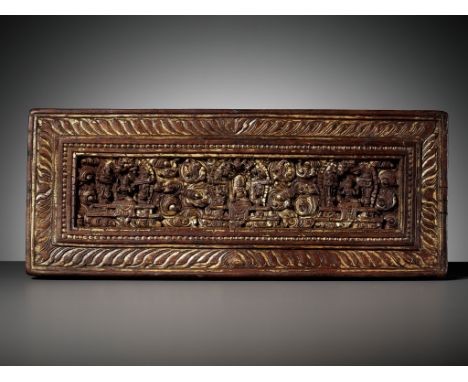 A GILT HARDWOOD MANUSCRIPT COVER, TIBET, 14TH CENTURY 西藏十四世紀鎏金木雕經書封面Please note this Lot is to be sold at No Reserve. 本拍品不設底價