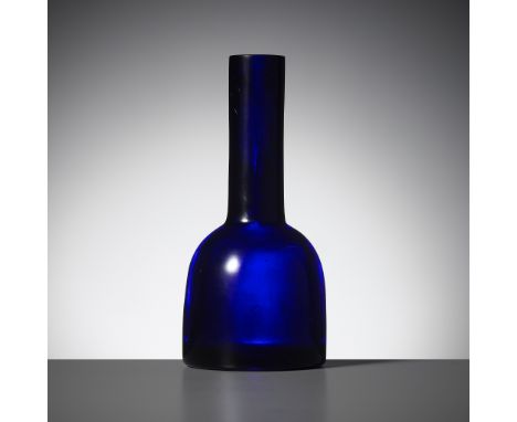 AN IMPERIAL INDIGO-BLUE GLASS MALLET VASE, GUANGXU MARK AND OF THE PERIOD 光緒款及年代御製藍寶石色料馬蹄式瓶Please note this Lot is to be sold