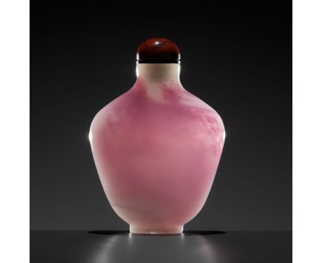 A PINK AND WHITE SANDWICHED GLASS SNUFF BOTTLE, CHINA, 1730-1820 1730-1820年紅白套料鼻煙壺Please note this Lot is to be sold at No Re