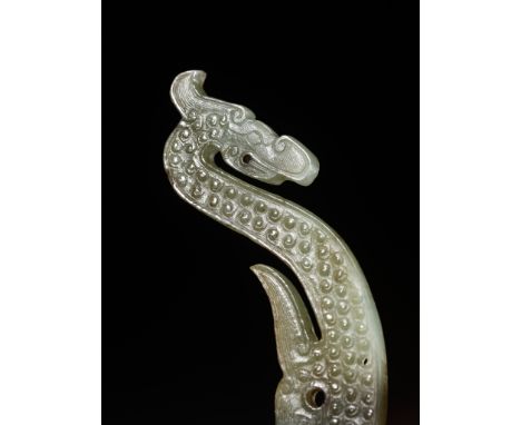 A GREEN JADE ‘DRAGON’ SILHOUETTE PENDANT, MID-EASTERN ZHOU DYNASTY 東周中期龍形玉佩Please note this Lot is to be sold at No Reserve. 