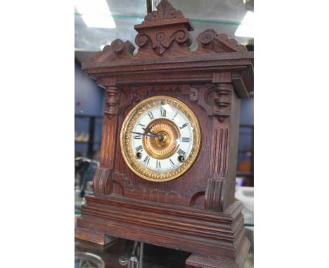 LATE 19TH CENTURY ANTONIA USA MANTEL CLOCK
the circular ceramic and gilt dial with Roman numerals, the rectangular case with 
