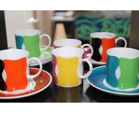 SIX SUSIE COOPER COFFEE CANS AND SIX SAUCERS
