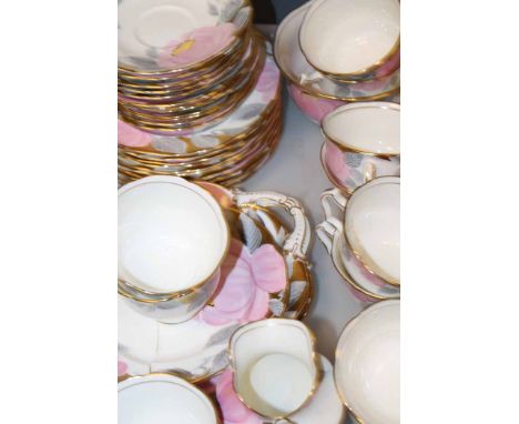 CRESCENT & SONS HAND-PAINTED TEA SERVICE
with hand-painted pink floral and gilt decorations (with one broken plate - all piec