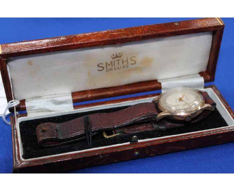 GENTLEMAN'S SMITHS DELUXE NINE CARAT GOLD WRISTWATCH
the dial with Arabic numerals, signed manual wind movement, fitted to a 