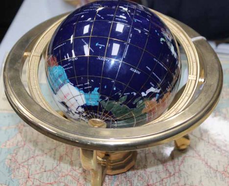 20TH CENTURY GLOBE SET WITH HARDSTONE INLAID COUNTRIES 
on yellow metal axis and base, 25cm high; together with two modern ma