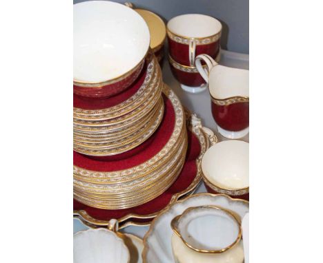 CRESCENT AND SONS TEA SERVICE
with red and gilt transfer-printed decorations; together with another floral and gilt part tea 