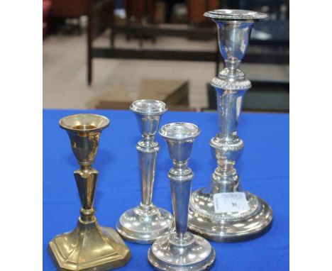 PAIR OF SILVER DWARF CANDLESTICKS
together with a larger silver plated candlestick with a silver scole and a brass candlestic