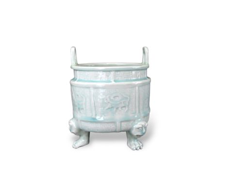 An Extremely Rare Qingbai Censor, Song/Yuan dynasty raised on three claw legs surmounted by animal masks, carved with archais