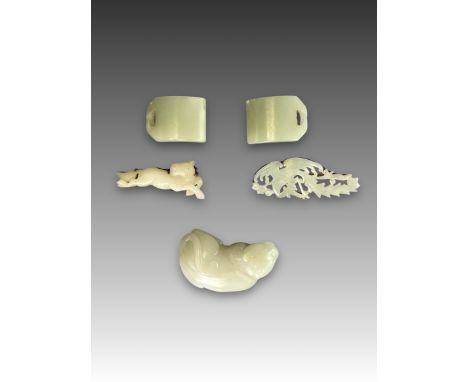 Celadon Jade: a Cat, with Two Appliques and Two  Belt Clasps, Qing dynasty,  the recumbent cat well carved, one applique an o