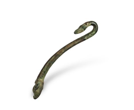 An Archaic Bronze Belthook, Warring States, very finely worked, the bronze with a soft green patina, the slender curving shaf