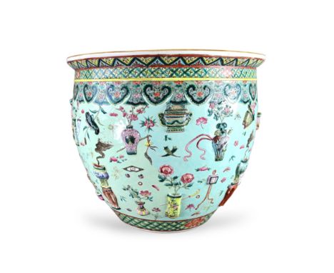 A Large 'famille rose' Jardiniere with Moulded Decoration, 19th century the rounded sides decorated on a leaf green field wit