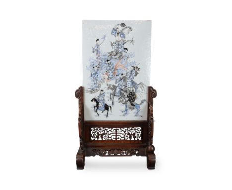 An 'Eight Immortals' Plaque, 19th century, the rectangular porcelain plaque pencilled in blue enamel,iron red and black, with