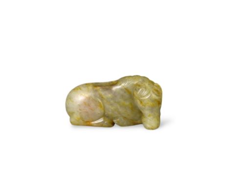 A Jade Seated Horse, 17th century,  softly carved from a greyish celadon stone with faint russet suffusions, his back pierced