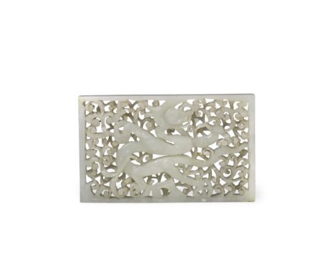 A Good White Jade Dragon Belt Plaque, Ming dynasty, of rectangular form, carved and pierced in low openwork relief with a fie