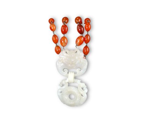 A White Jade Interlocking Pendant, and a Burnt Jade Cat, 19/20th century,  the pendant, which hangs from a carnelian bead nec