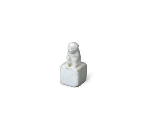 A Rare 'blanc de chine' Miniature Seal with Monkey Finial, Kangxi, of cube form, carved with a four character sealmark to the