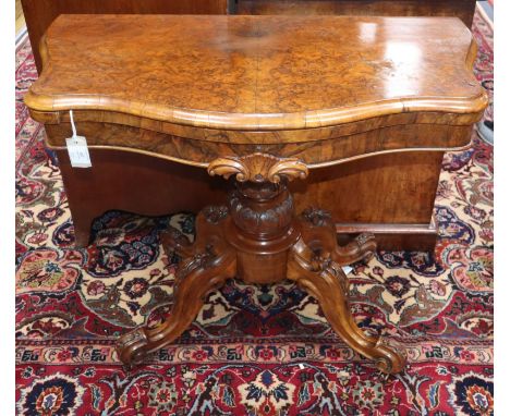 A Victorian burr walnut serpentine folding card table W.88cm