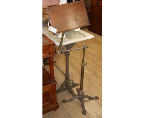 A Victorian Norths patent cast iron and brass reading table H.120cm