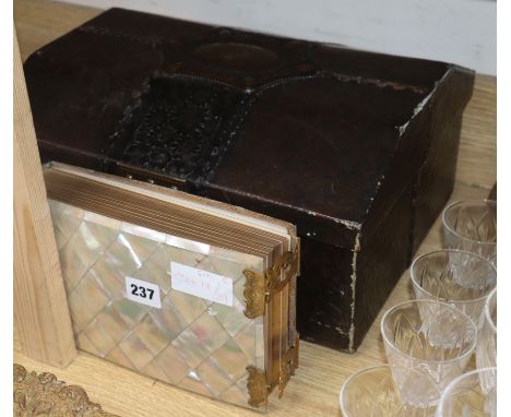 A Victorian mother of pearl photograph album and a leather mounted casket