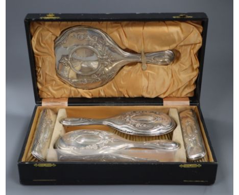 A cased George V silver six piece dressing table set.