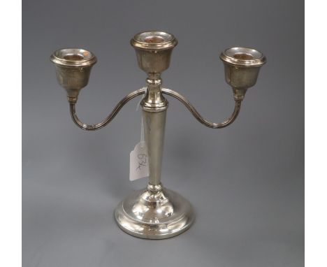 A modern silver two branch, three light candelabrum, 22.6cm.