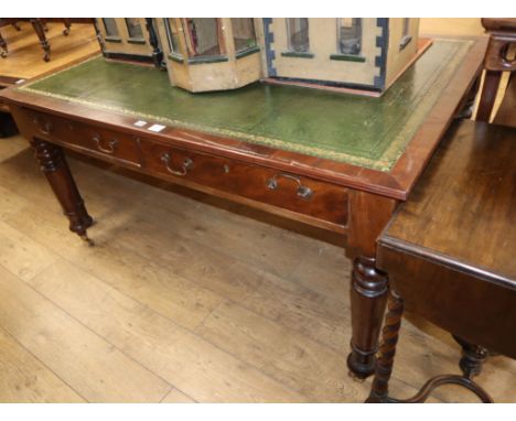 A Victorian mahogany partner's writing table, with green gilt tooled leather inset top W.150cm