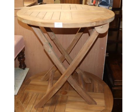 A circular teak circular folding garden table Diam. 70cm