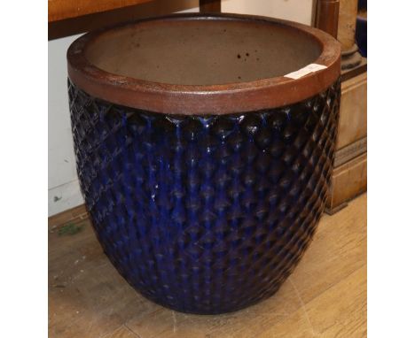 A blue glazed moulded body garden planter Diam.50cm