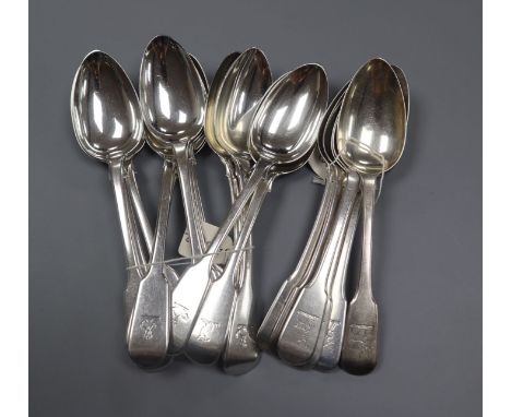 A set of six George III silver dessert fiddle pattern dessert spoons, London, 1814 and a harlequin set of twelve similar spoo
