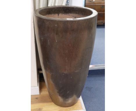 A tall gold glazed garden planter H.90cm