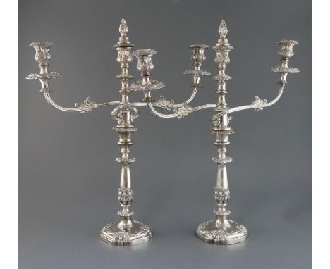 A pair of 19th century Sheffield plate two branch three light candelabra, with engraved crest, 52.5cm.