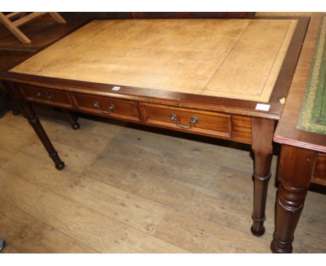 A Victorian style mahogany three drawer writing table W.150cm