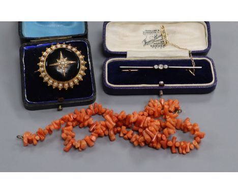 An Edwardian 15ct and diamond bar brooch, a Victorian seed pearl and enamel brooch and a coral necklace.