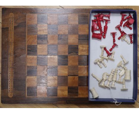 A 19th century ivory chess set and a Victorian inlaid rosewood games board