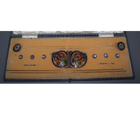 A cased early 20th century metal and enamel hatpin, buckle and button set.